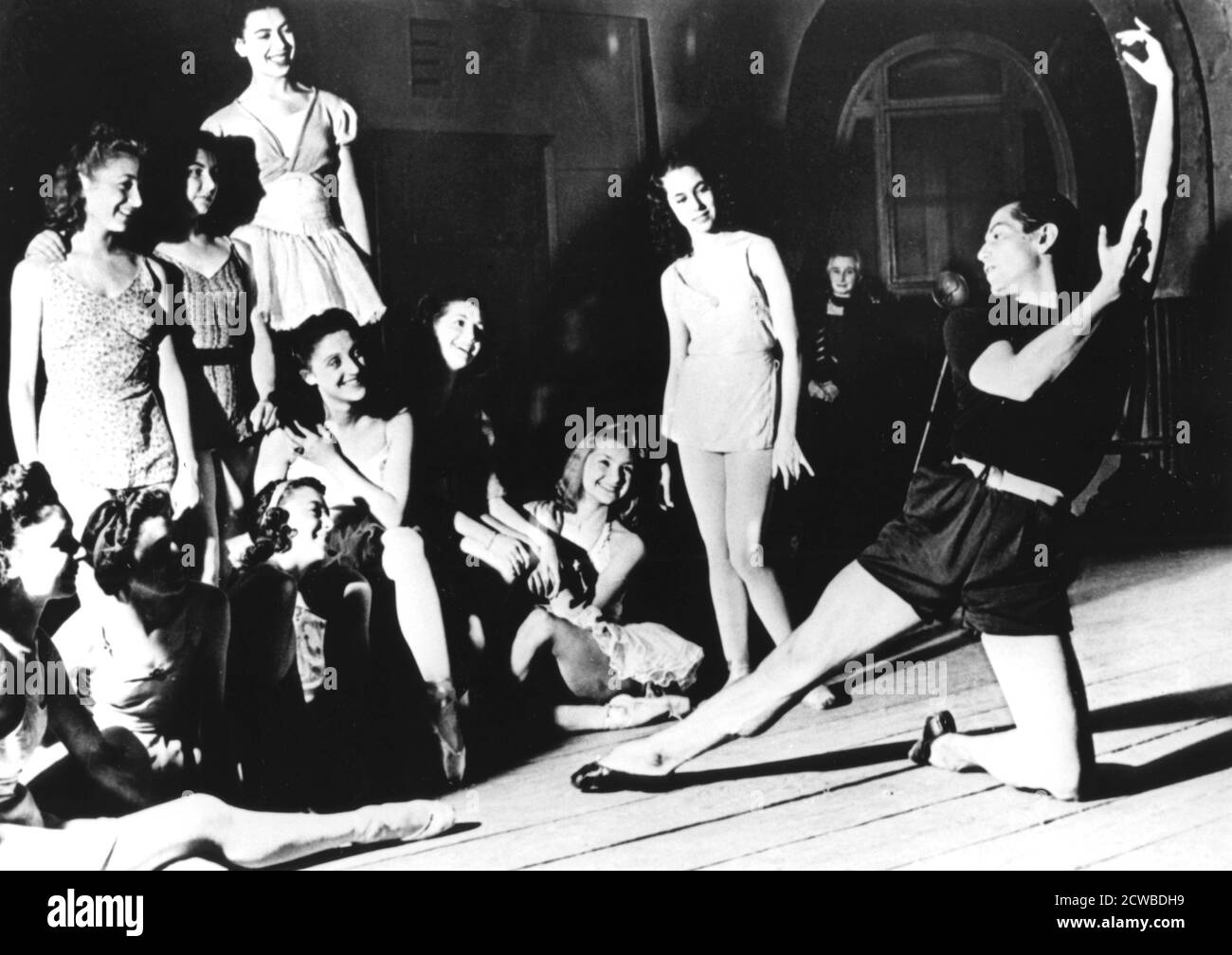 Serge Lifar and the Paris Opera Ballet, Paris, 1940-1944. Born in the Ukraine, Lifar (1905-1986) was appointed director of the Paris Opera Ballet in 1930. He was dismissed in 1945 because of his socialising with members of the German High Command during the Nazi Occupation of Paris, although Lifar claimed he was in fact working as an Allied agent. His lifetime banishment only lasted two years as he was reinstated in 1947. The photographer is unknown. Stock Photo