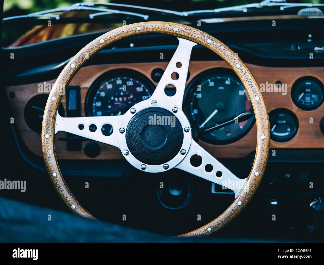The steering wheel and dashboard of an antique classic car Stock Photo