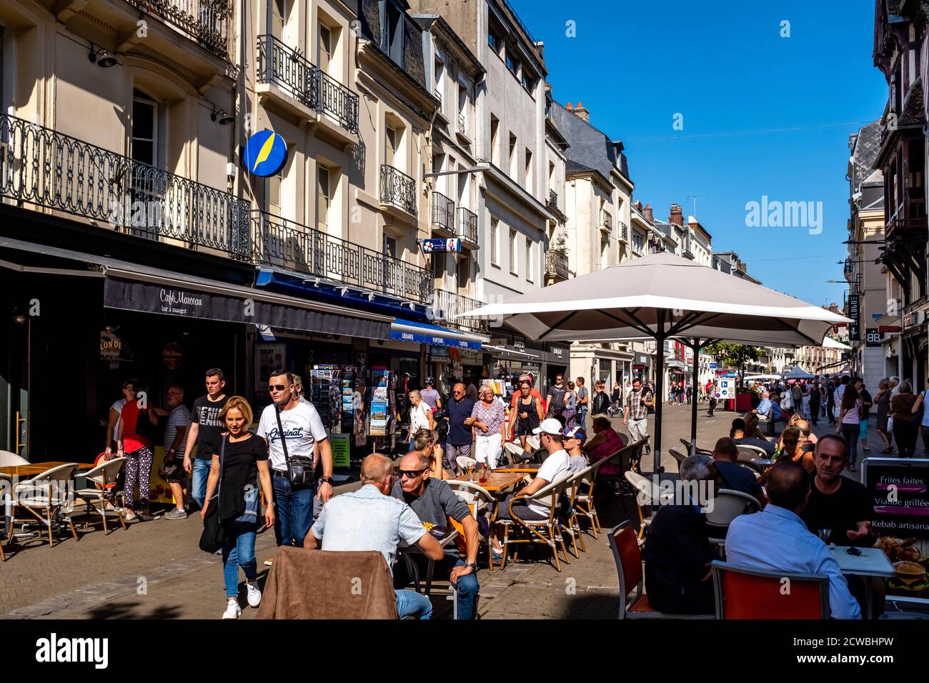 Local People Sitting At A Street Cafe In The Town Of Dieppe, Normandy, France. Stock Photo