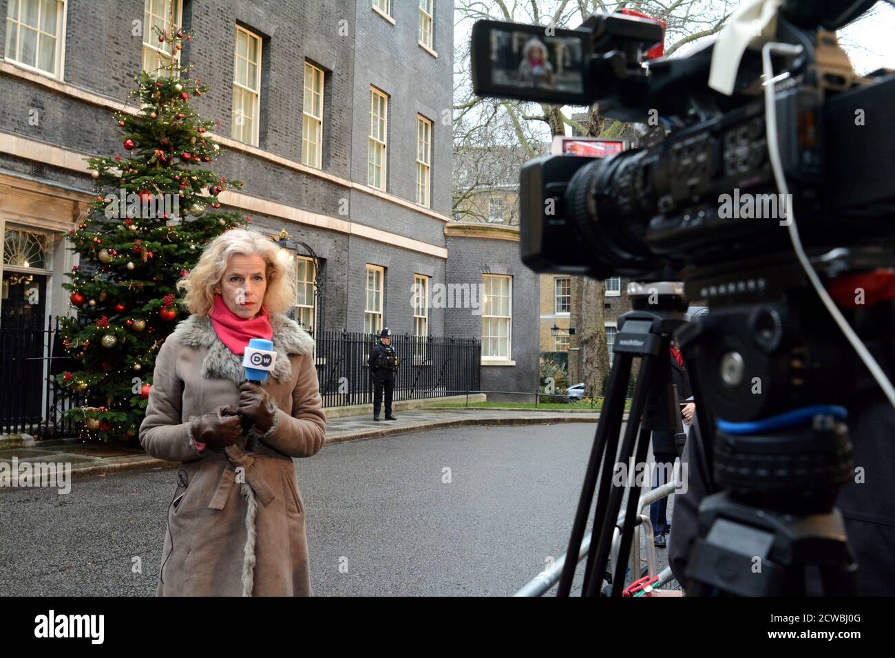 Photograph of members of the press reporting outside of 10 Downing Street Stock Photo
