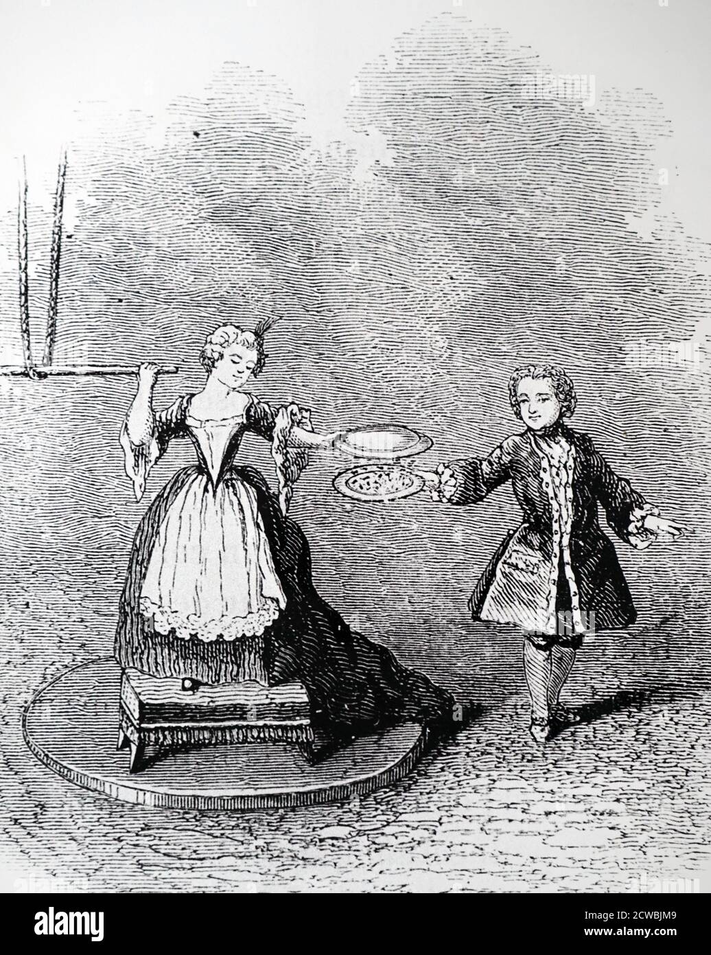 Engraving titled 'Dance of the Puppets' : Girl stands on resin block charged up by a Watson glass-globe electrical machine. In her left hand she holds an inverted metal plate, while the boy stands on the floor holding a similar plate containing pieces of pith. Static charges causes the pith to jump about. Stock Photo