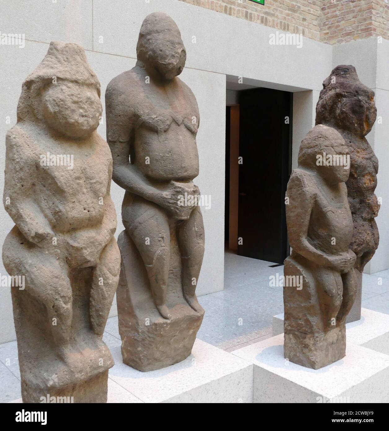 Sandstone Cuman stone figures of men and women Stock Photo