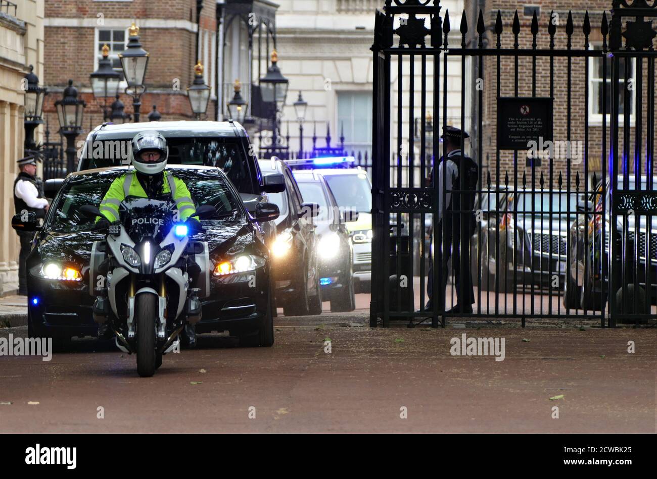 Photograph of the armed police security at St James' Palace for a departing minister after meeting US President Donald Trump, during his visit to London. June 2019 Stock Photo