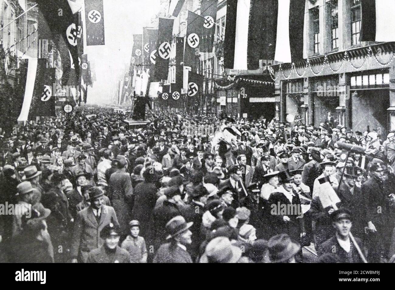 Black and white photo of the aftermath of the Saar Plebiscite, 13 January 1935; people in the streets after the results are announced. Stock Photo