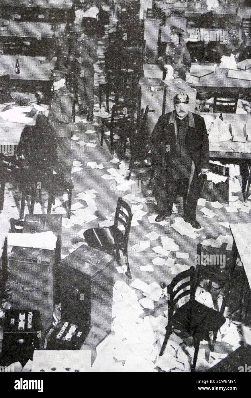 Black and white photo of the aftermath of the Saar Plebiscite, 13 January 1935; an empty room with papers strewn over the floor. Stock Photo