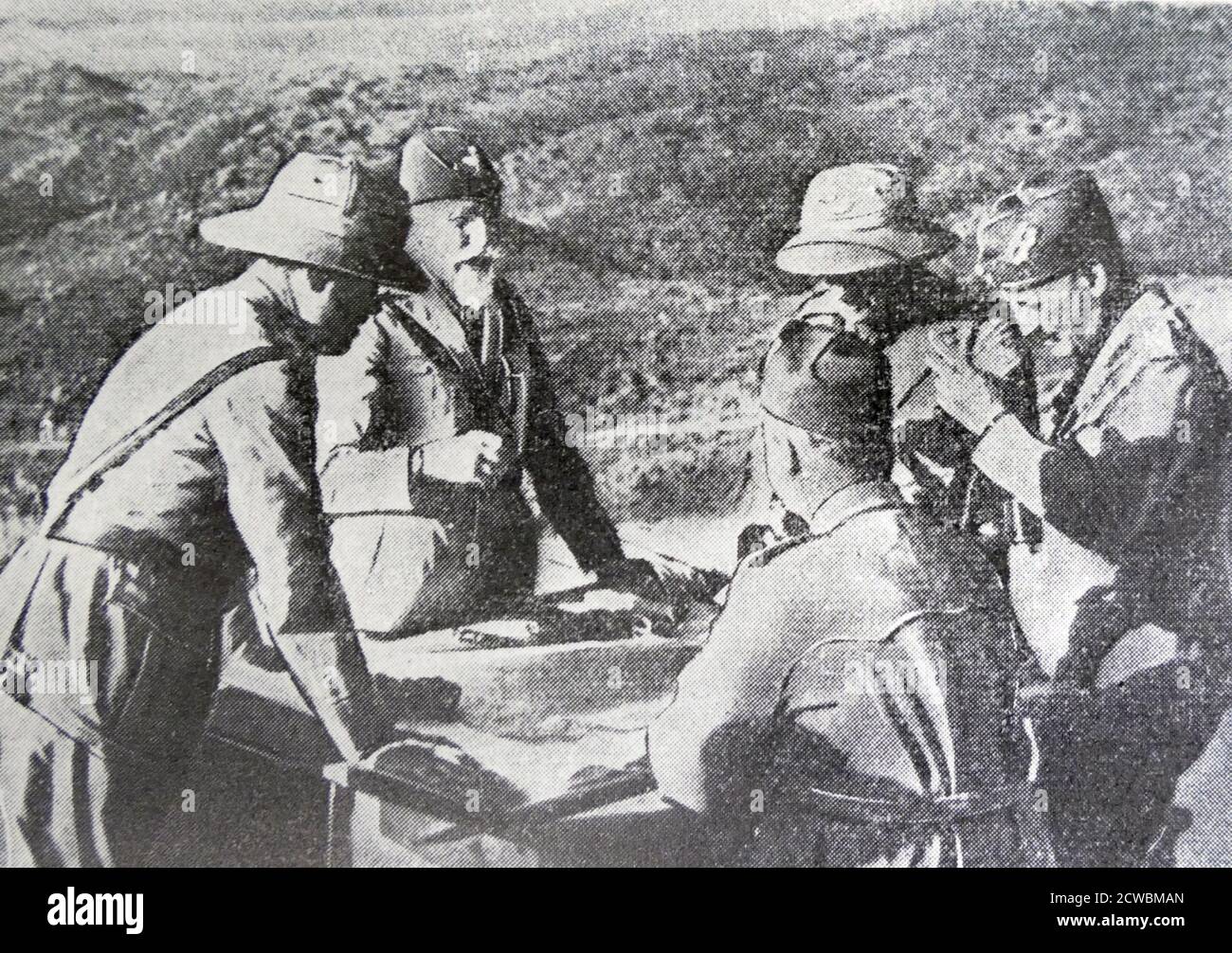 Black and white photo of the War in Ethiopia after the Italian invasion of 1935; General Emilio de Bono (1866-1944), commander in chief of Italian forces in Ethiopia, consulting a map of the theatre of operations. Stock Photo