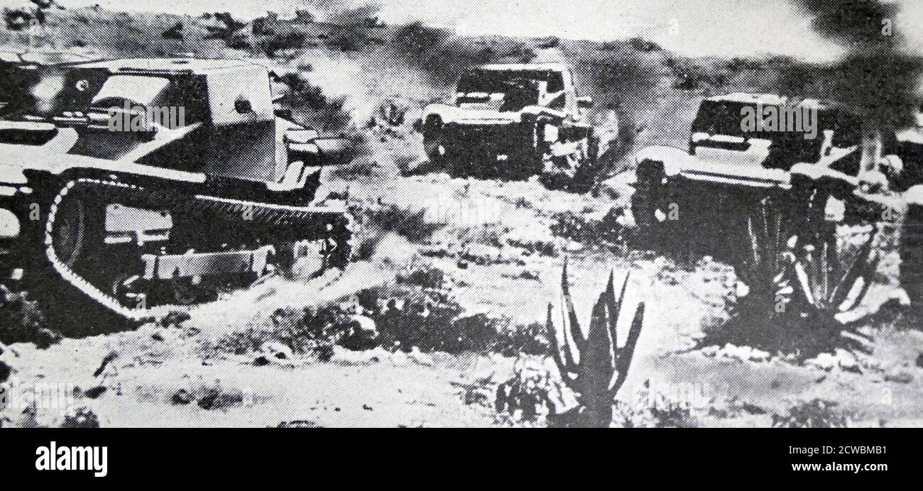 Black and white photo of the War in Ethiopia after the Italian invasion of 1935; Italian tanks firing their machine guns. Stock Photo