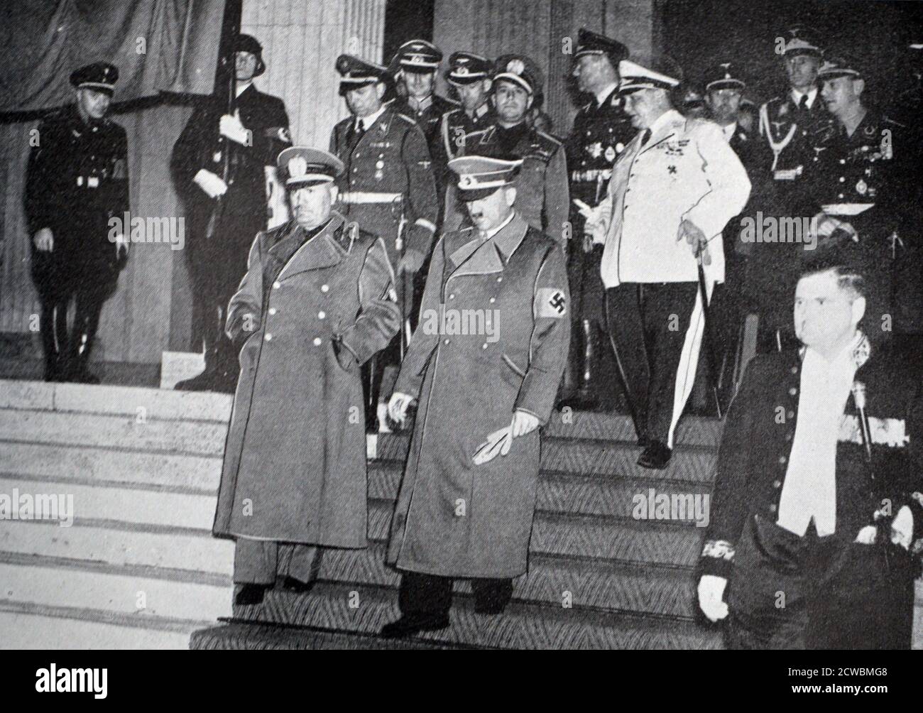 Black and white photo of Hitler and Mussolini exiting the main hall at the Munich Conference. Stock Photo