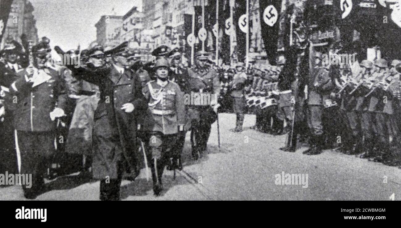 Black and white photograph pertaining to the Munich Conference of 1938 showing leaders of the four participating nations returning from Munich; Hitler returns to Berlin. Stock Photo
