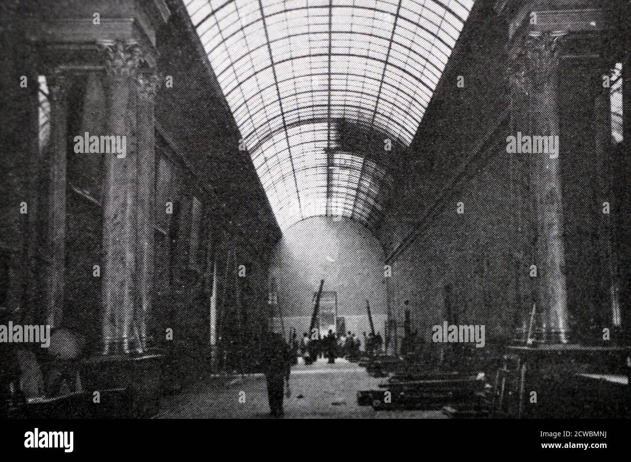 Black and white photograph pertaining to the first days of the war in Paris; inside the large gallery at the Louvre Museum, preparing artworks for protection in case of invasion. Stock Photo