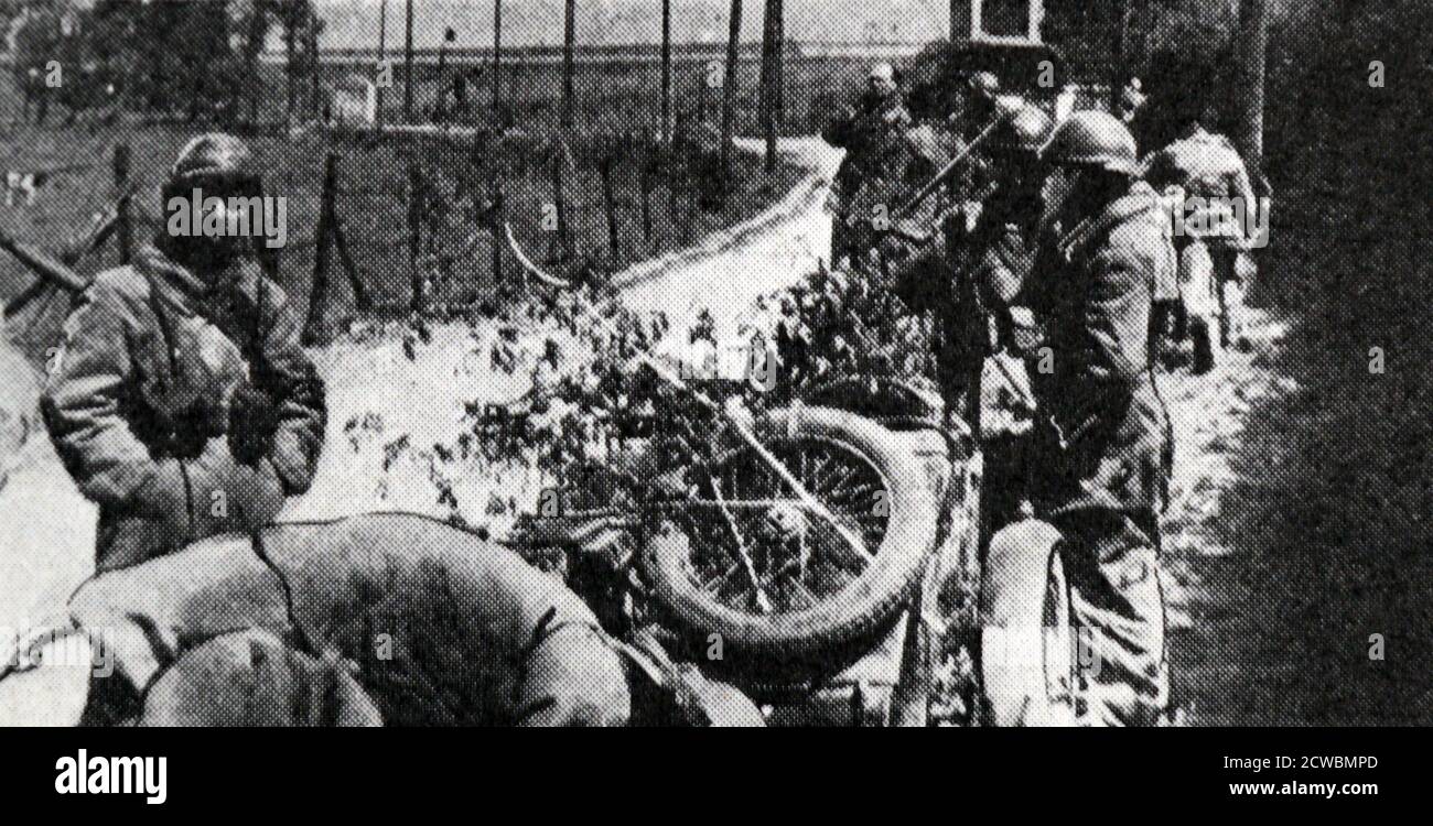 Black and white photograph of the Allies coming to save Belgium and the Netherlands; French troops on motorcycles driving through Belgium. Stock Photo