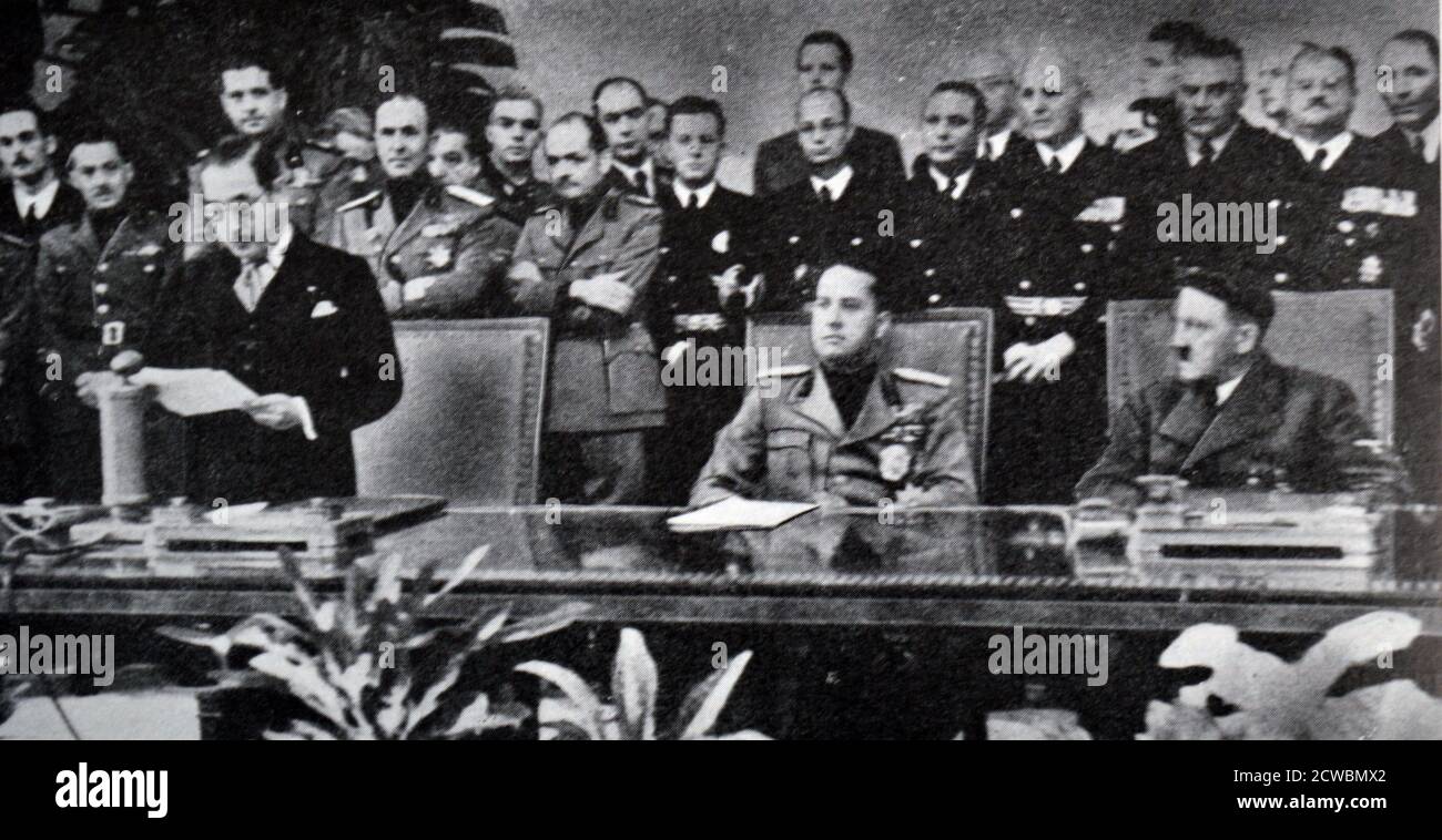Black and white photograph of World War II (1939-1945); The signing of the Tripartite Pact (also known as the Berlin Pact) between Germany, Italy and Japan on 27 September 1940. Pictured is the Japanese delegate Saburo Kirusu (1886-1954) delivering a speech; seated behind are Galeazzo Ciano (1903-1944) and Adolf Hitler (1889-1945). Stock Photo