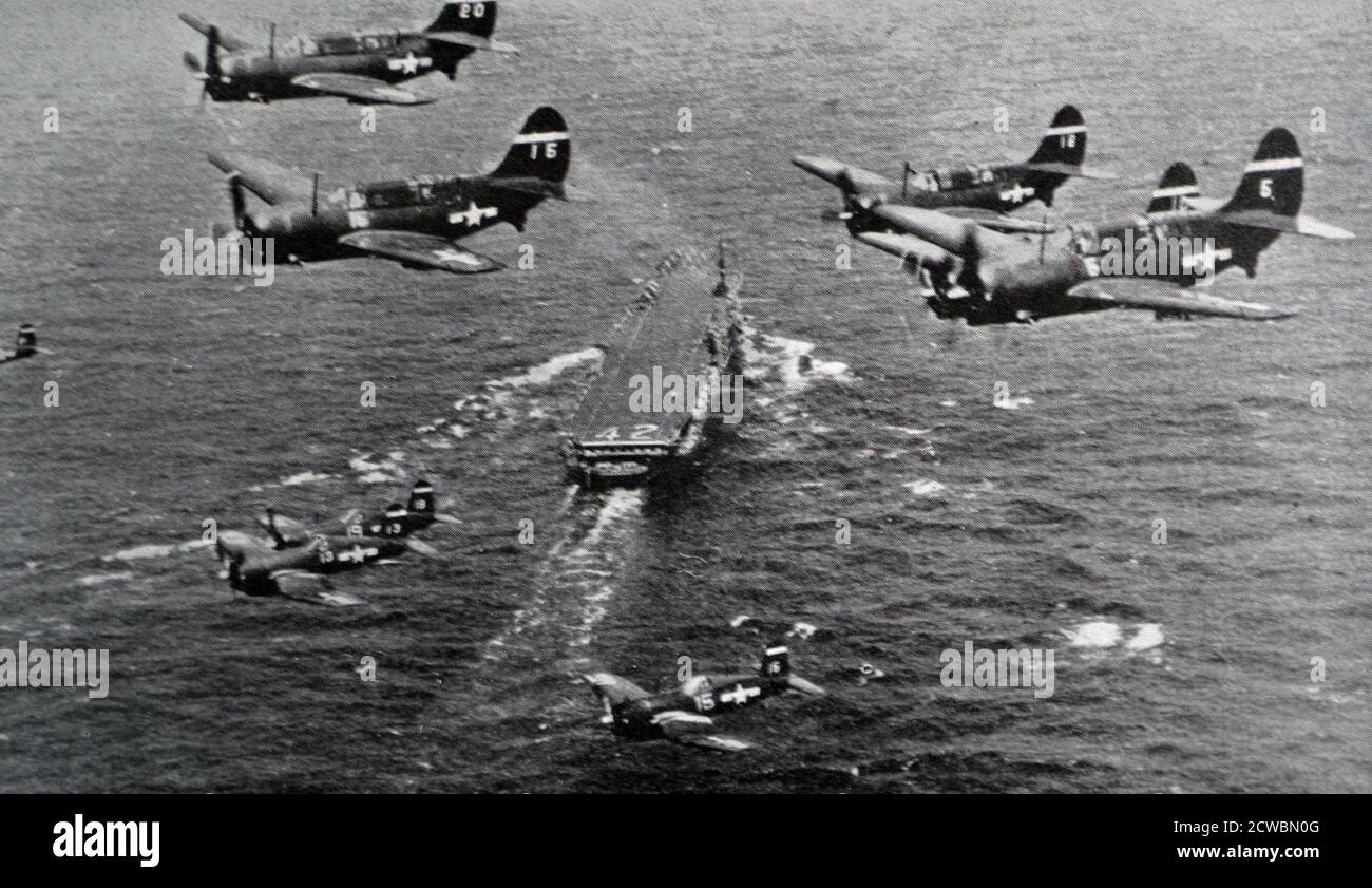 Black and white photograph of World War II (1939-1945); the Battle of the Coral Sea. American fighter planes having taken off from an aircraft carrier fly to attack the Japanese Navy. Stock Photo