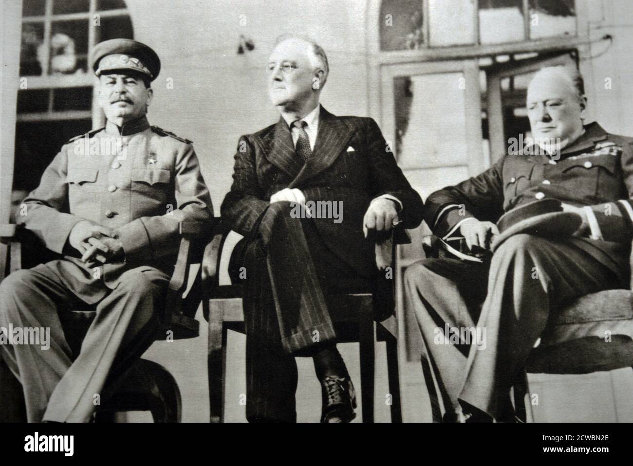 Black and white photograph of World War II (1939-1945) showing three leaders at the Tehran Conference: Soviet leader Josef Stalin (1878-1953), US President Franklin D. Roosevelt (1882-1945) and British Prime Minister Sir Winston Churchill (1874-1965). Stock Photo