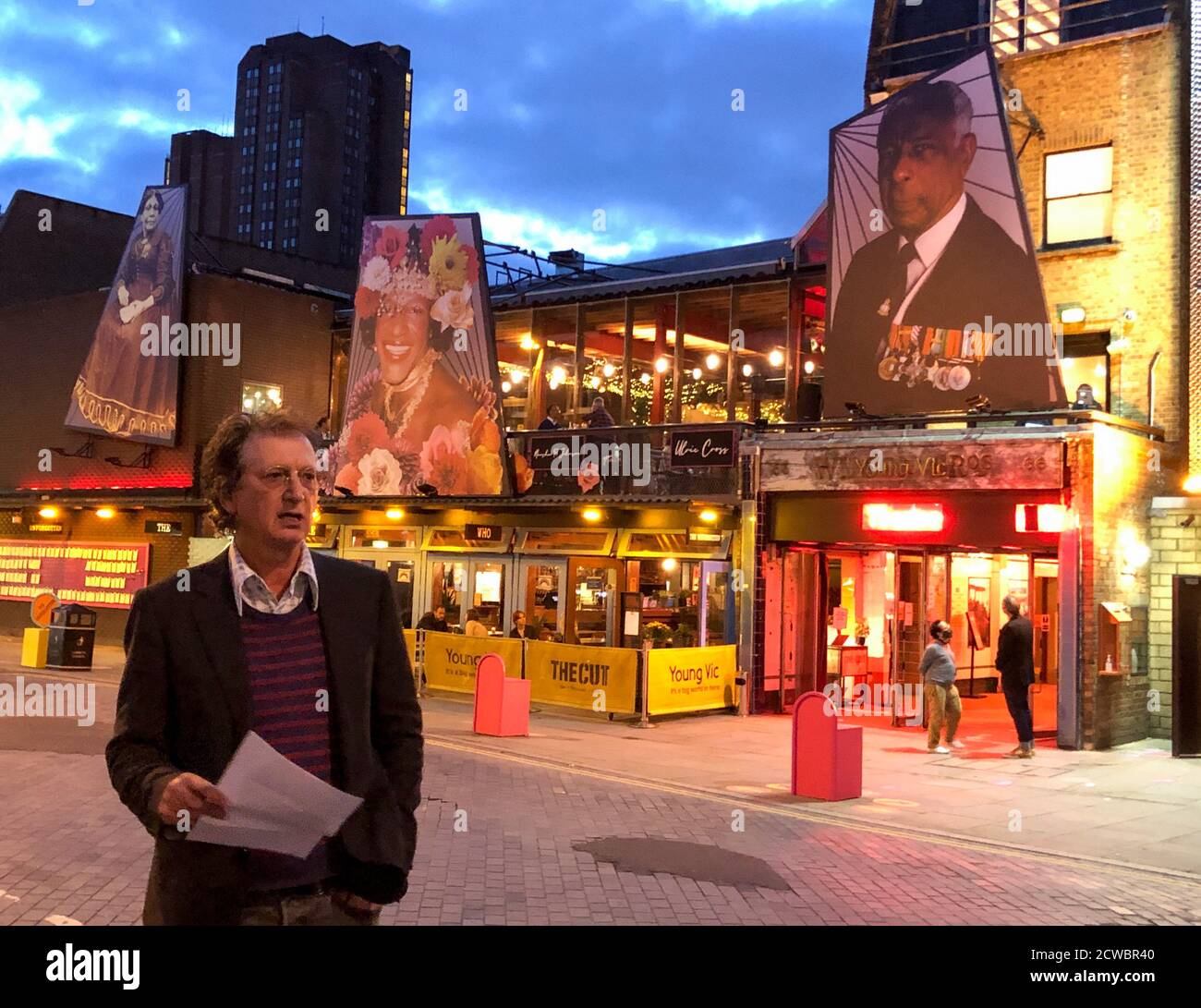 Former artistic director (2000-2018) David Lan speaks during a celebration marking 50 years since the September 1970 opening of The Young Vic theatre in The Cut, London SE1. In the background an outdoor art installation 'The Unforgotten' created by Sadeysa Greenway-Bailey & Anna Fleischle features portraits of unsung trailblazers Mary Seacole, Marsha P. Johnson and Ulric Cross. Stock Photo