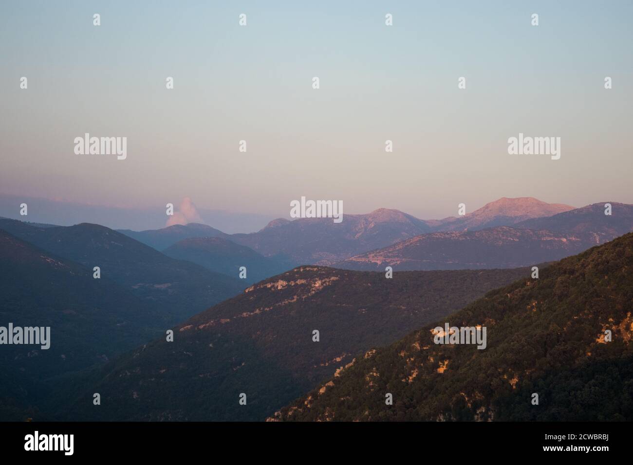 Greek Sunset over Mountain Range Stock Photo