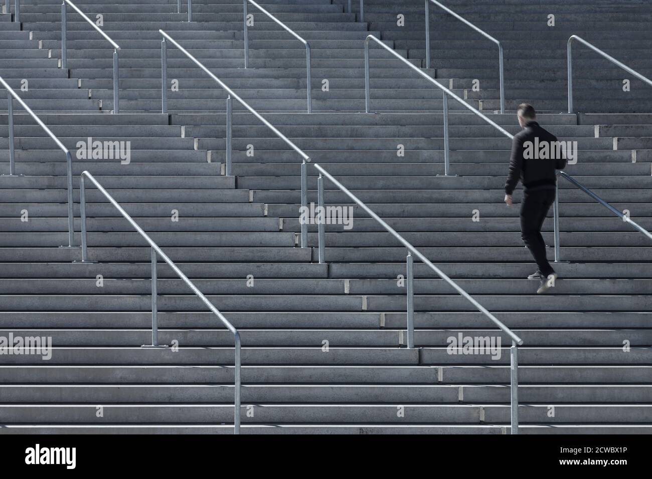 Black man running up stairs hi-res stock photography and images - Alamy
