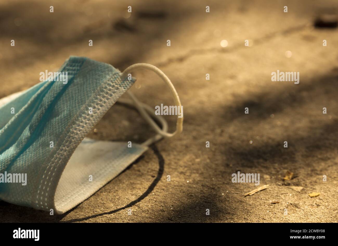 Medical mask lying on road hi-res stock photography and images - Alamy
