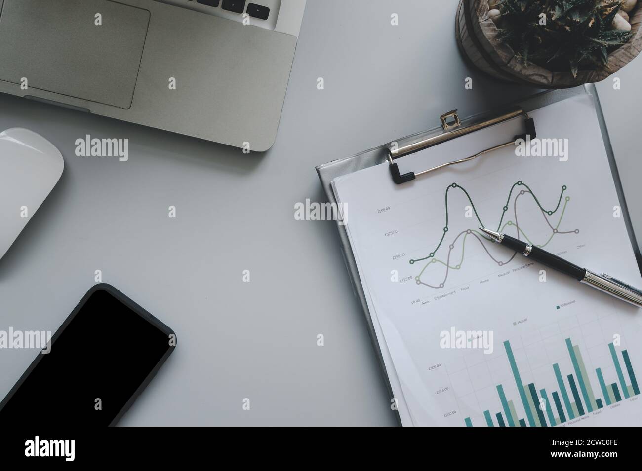 Desk paperwork graphs hi-res stock photography and images - Alamy