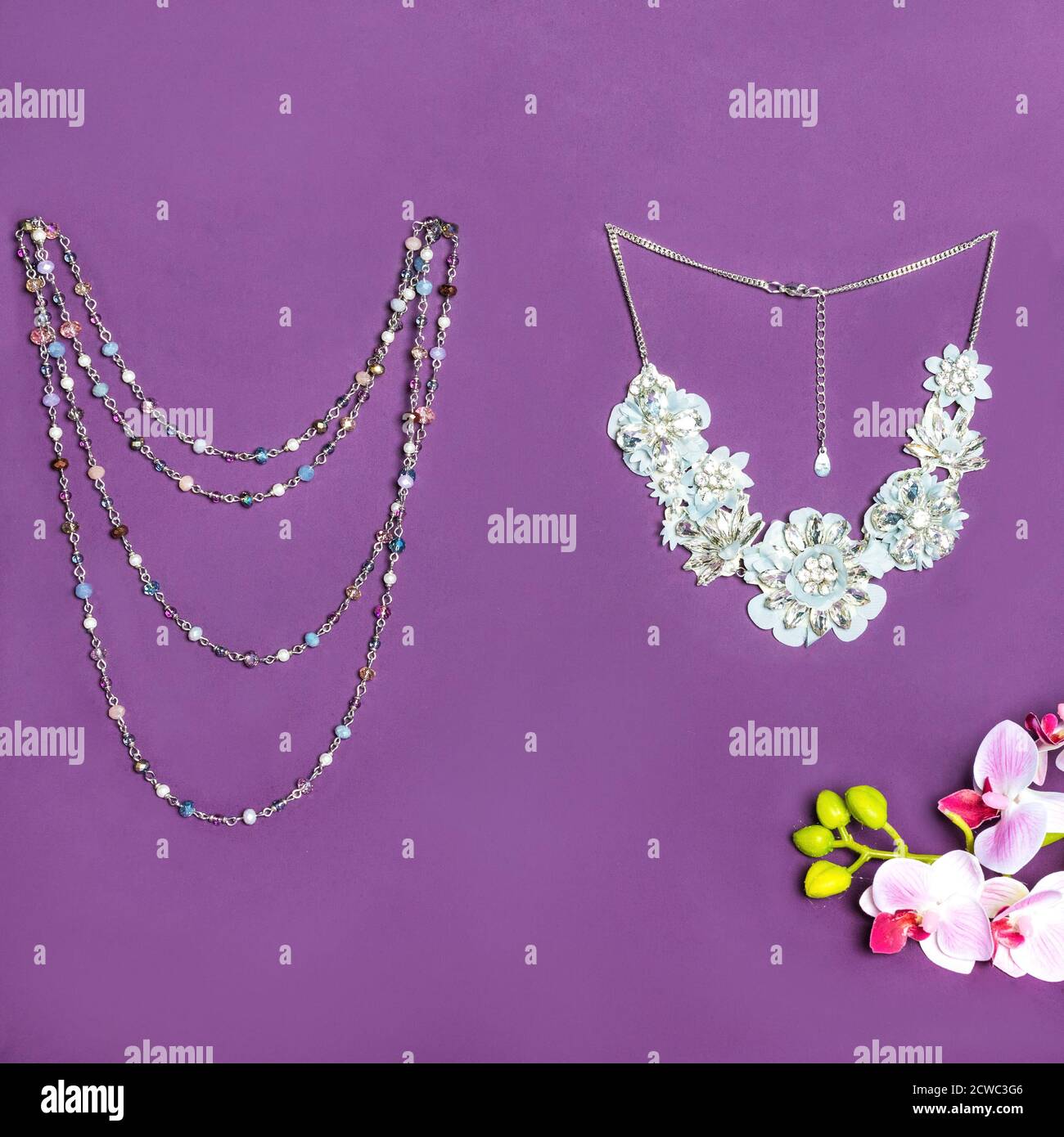 Elegant gold necklace with diamonds on purple background Stock Photo
