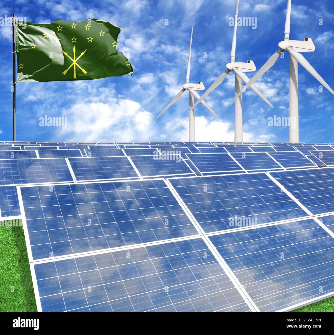 Solar panels on the background of a flagpole with the flag of Adygea and Wind Turbine Stock Photo