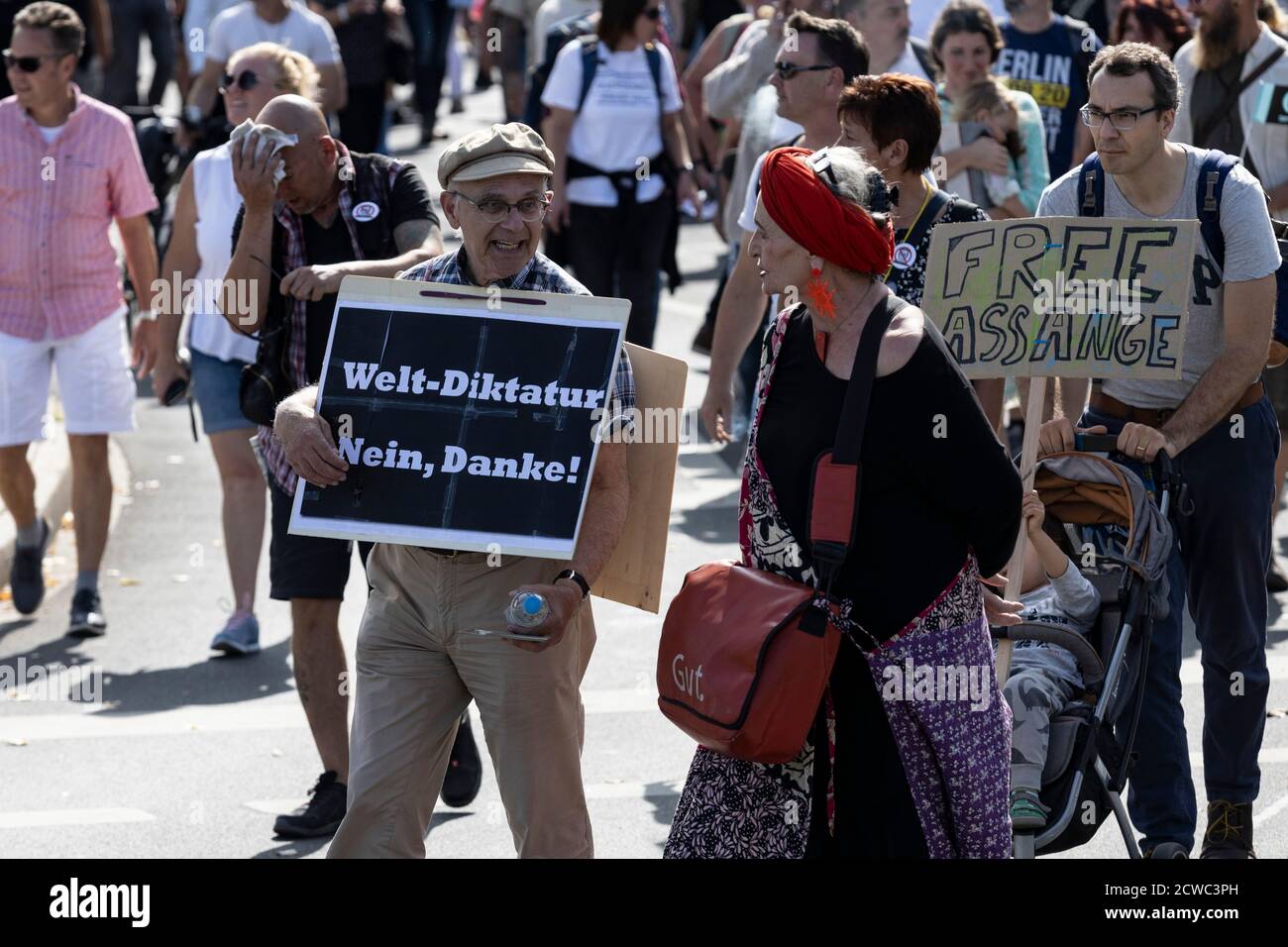 Man fighting world dictatorship. German Corona rebels protest against coronavirus restrictions such as the wearing of masks and assembly orders imposed by the German government, Düsseldorf, Germany. Stock Photo