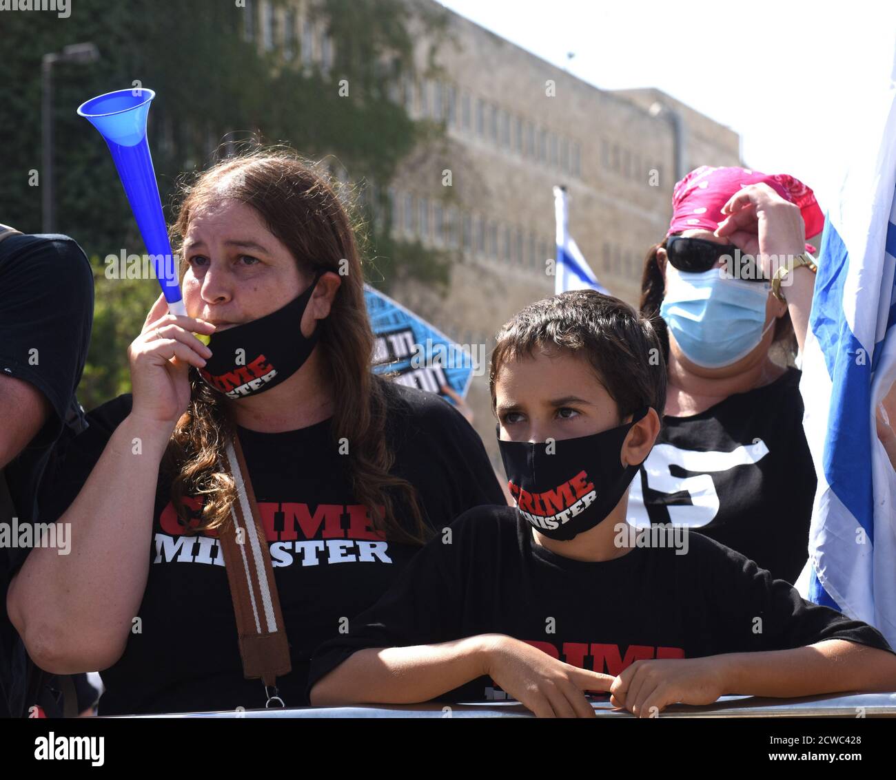 Jerusalem, Israel. 29th Sep, 2020. Israelis wear CRIME MINISTER t-shirts and masks at a demonstration during a nationwide COVID-19 lockdown, against Prime Minister Benjamin Netanyahu's proposed bill to restrict protests, outside the Knesset, the Parliament, on Tuesday in Jerusalem, September 29, 2020. The bill would forbid demonstrators from traveling more than one kilometer, 0.621 mile, from their homes, therefore stopping the weekly anti-Netanyahu protests outside his residence in Jerusalem. Photo by Debbie Hill/UPI Credit: UPI/Alamy Live News Stock Photo
