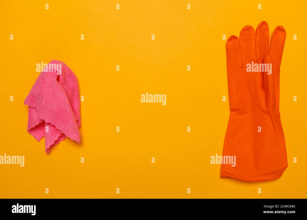 rag for cleaning and orange rubber. place for text. Stock Photo