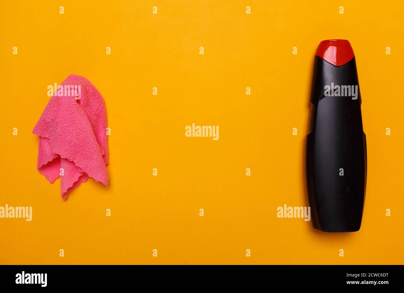 cleaning rag and black bottle with rust remover. place for text. Stock Photo