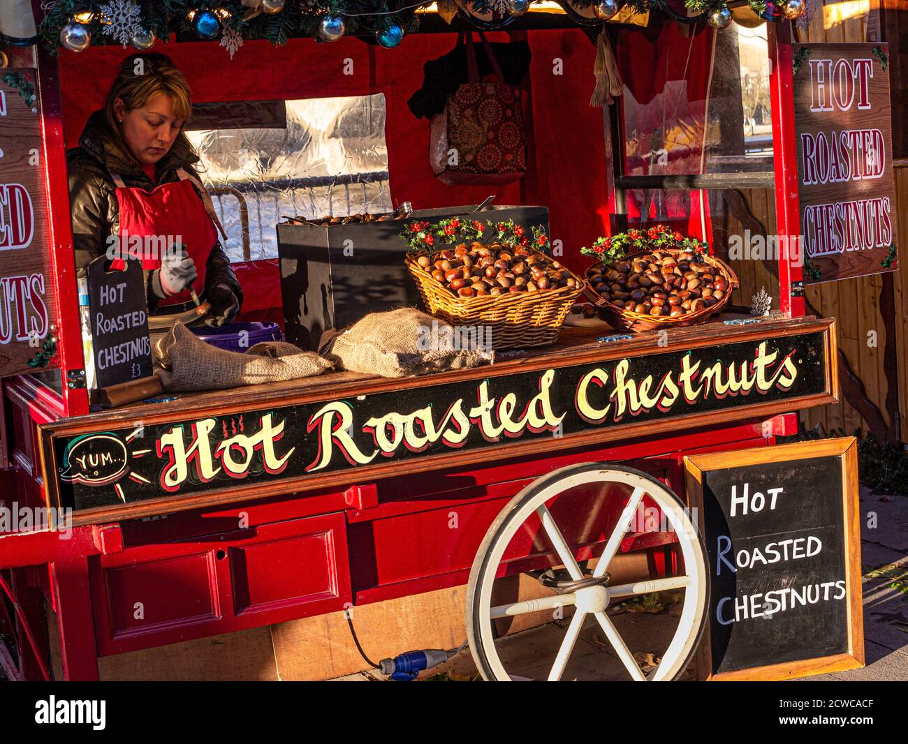 ROASTED CHESTNUTS Traditional Christmas winter market stall 'Hot Roasted Chestnuts' South Bank London UK Stock Photo