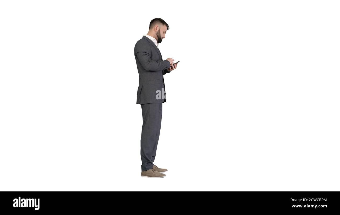 Turk business man using his phone on white background. Stock Photo