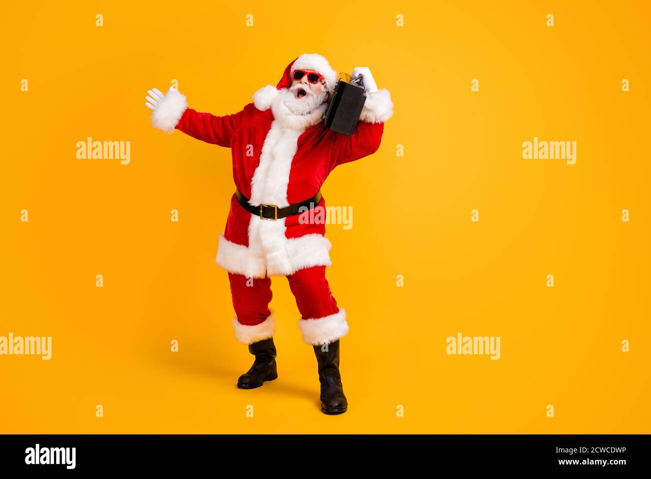 Full length body size view of his he nice funny cheerful cheery  white-haired Santa dj mc deejay carrying boombox dancing having fun  isolated bright Stock Photo - Alamy
