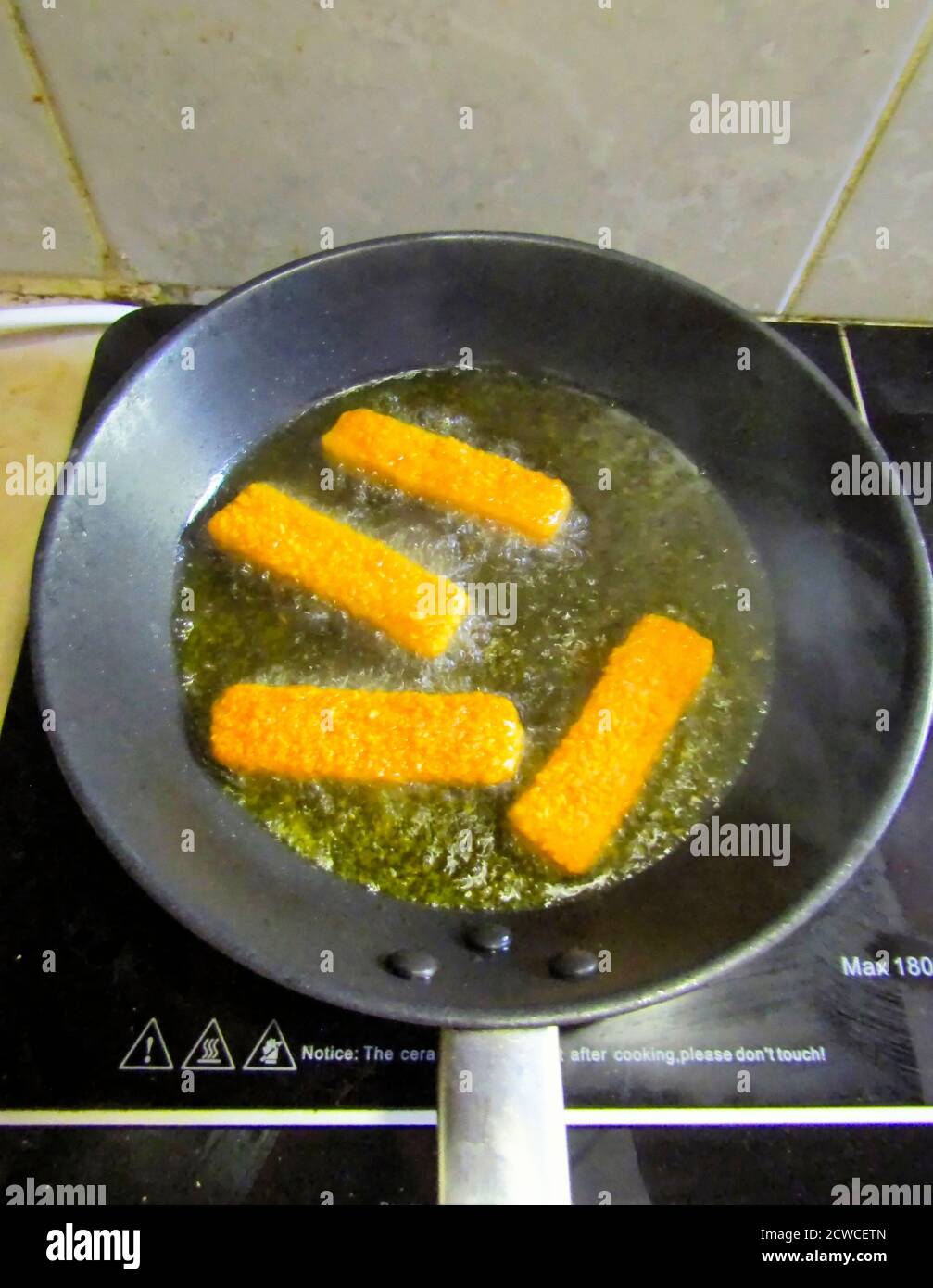 Frying Fish Fingers Stock Photo Alamy