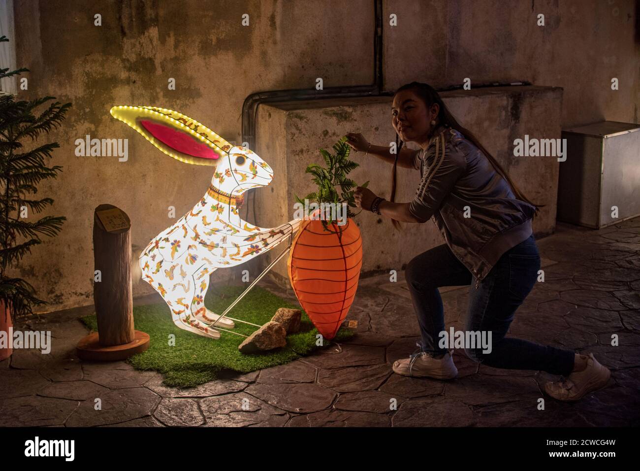 Kuala Lumpur, Malaysia. 29th Sep, 2020. A woman poses for photos with a ...