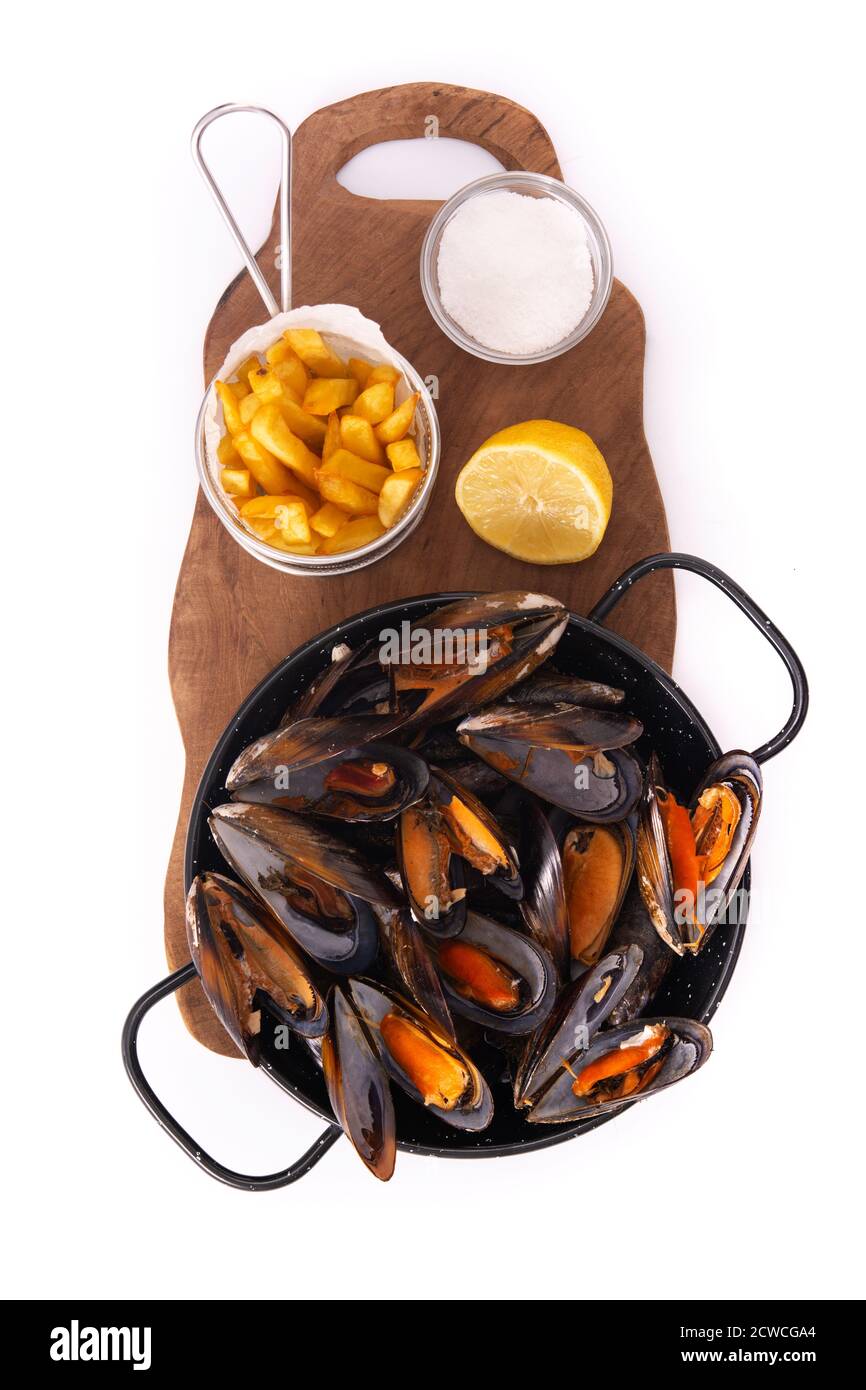 Mussels and french fries or moulesfrites isolated on white background