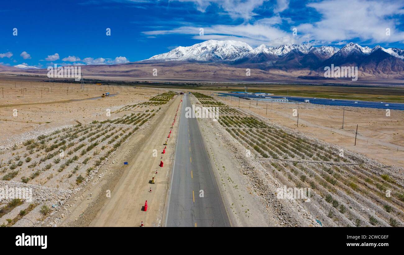 (200929) -- URUMQI, Sept. 29, 2020 (Xinhua) -- Aerial photo taken on June 14, 2019 shows a section of Karakorum Highway (KKH) on the Pamir Plateau, northwest China's Xinjiang Uygur Autonomous Region. Xinjiang has invested 397.3 billion yuan (around 58.3 billion U.S. dollars) between 2014 and 2019 in road construction, local authorities said.   This was 1.53 times the total investment in road construction in Xinjiang between 1949 and 2013, said the regional transport department. (Xinhua/Hu Huhu) Stock Photo