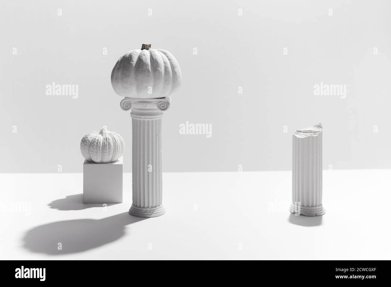 minimal concept with pumpkin and antique columns, for product presentation. Hollyday background. Stock Photo