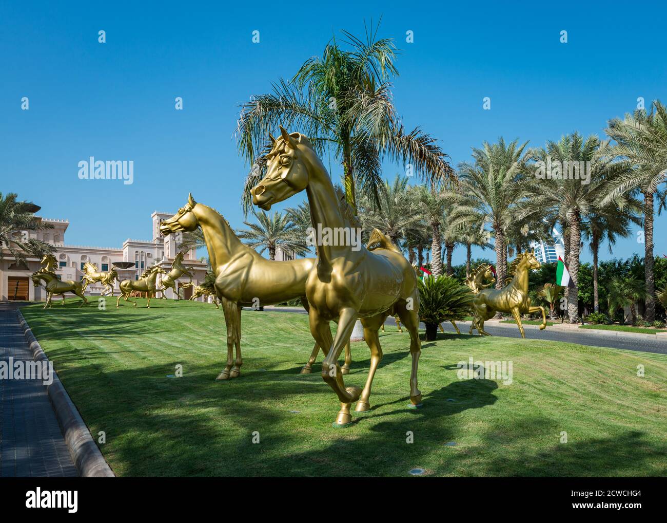 Entrance to the Jumeirah Al Qasr hotel with eighteen beautiful sculpted Arabian horse statues done by Danie de Jager,  Dubai, United Arab Emirates Stock Photo