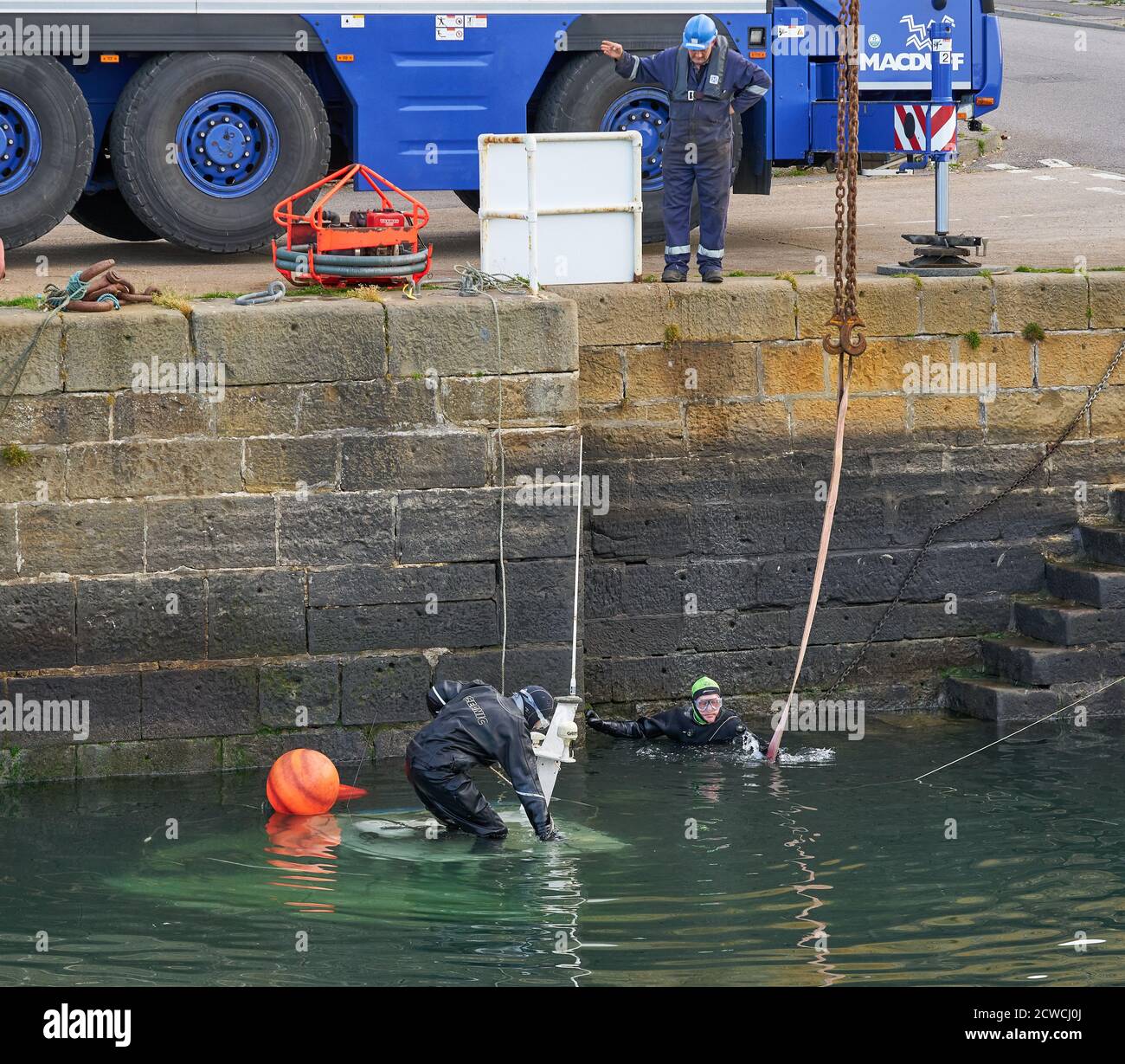 Burghead Harbour, Moray, UK. 29th Sep, 2020. UK. This is the small fishing boat Sula which sank due to a faulty valve system within the Harbour 27/28 Sep. This shows it being recovered from the depths by using a Crane and Divers. Credit: JASPERIMAGE/Alamy Live News Stock Photo