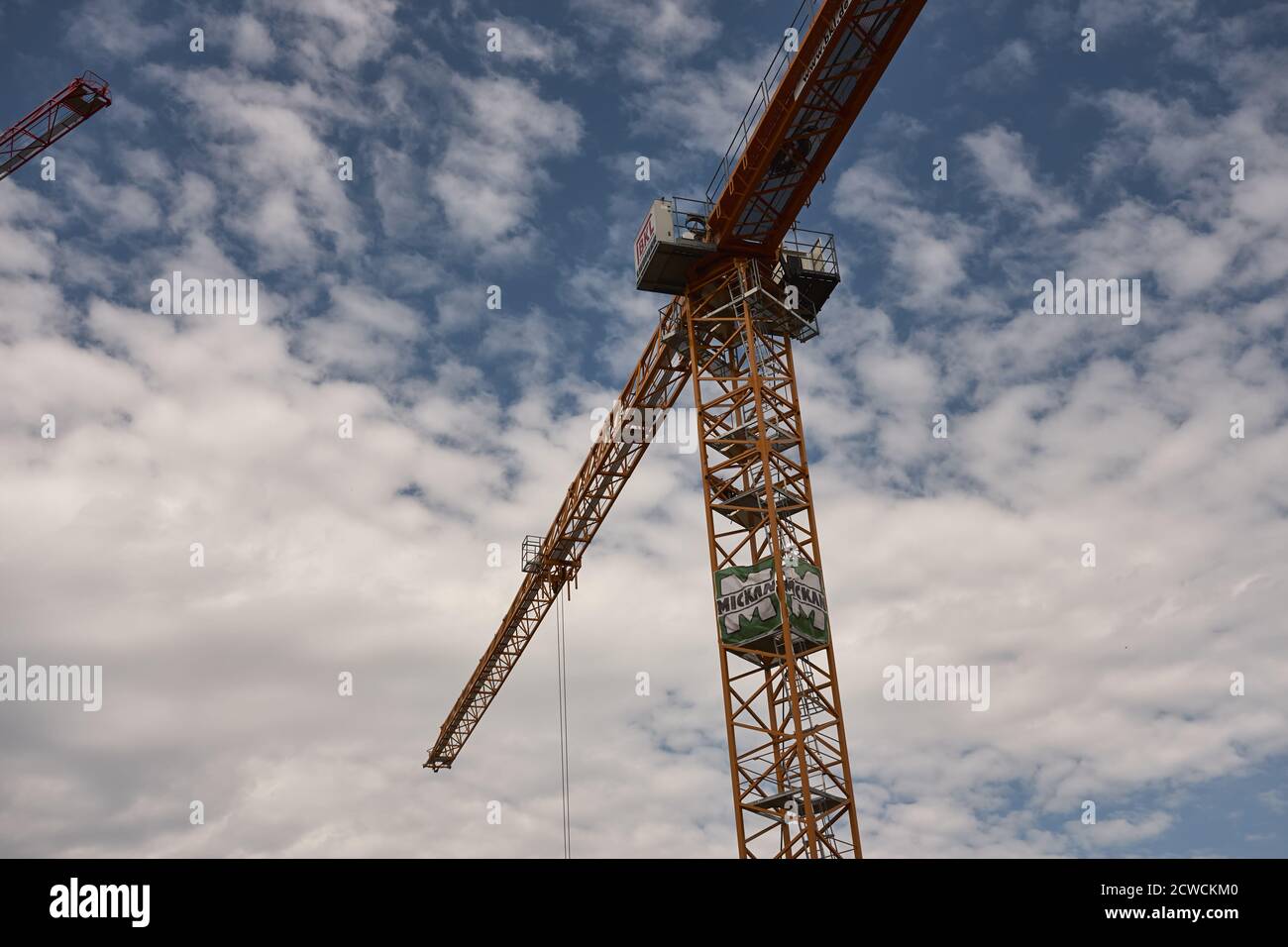 Low angle shot of a tower crane on a cloudy sky background Stock Photo ...