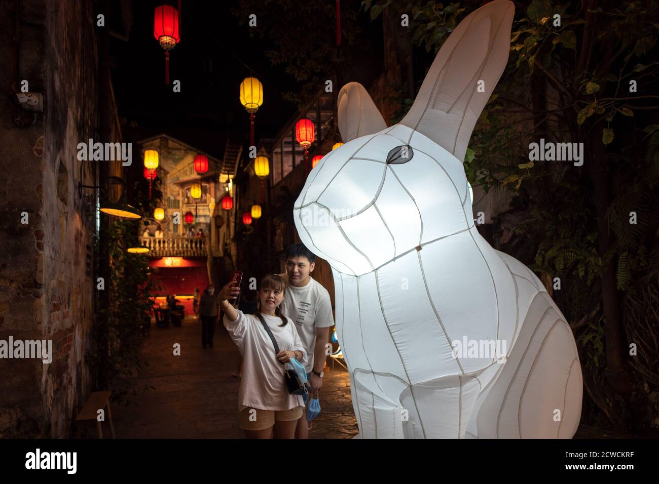 Kuala Lumpur, Malaysia. 29th Sep, 2020. People pose for photos with a ...