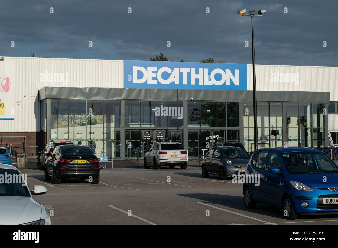Decathlon sports retailer store with parked cars, Stockport, UK Stock Photo