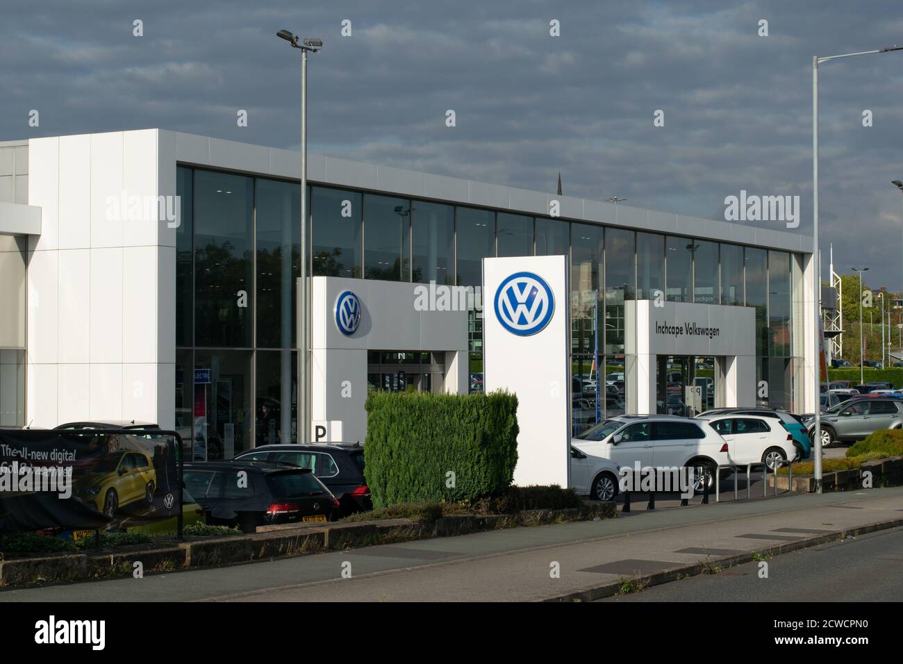 Volkswagen Inchcape car dealership, Stockport, UK with cars parked on forecourt. Stock Photo