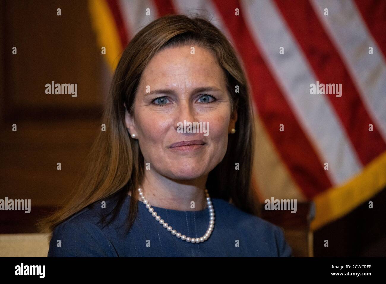 Judge Amy Coney Barrett, U.S. President Donald Trump's nominee for the U.S. Supreme Court, reacts, in the Capitol, in Washington, U.S., September 29, 2020. Graeme Jennings/Pool via REUTERS Stock Photo