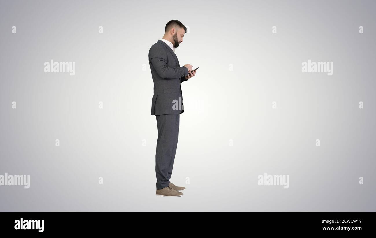Turk business man using his phone on gradient background. Stock Photo