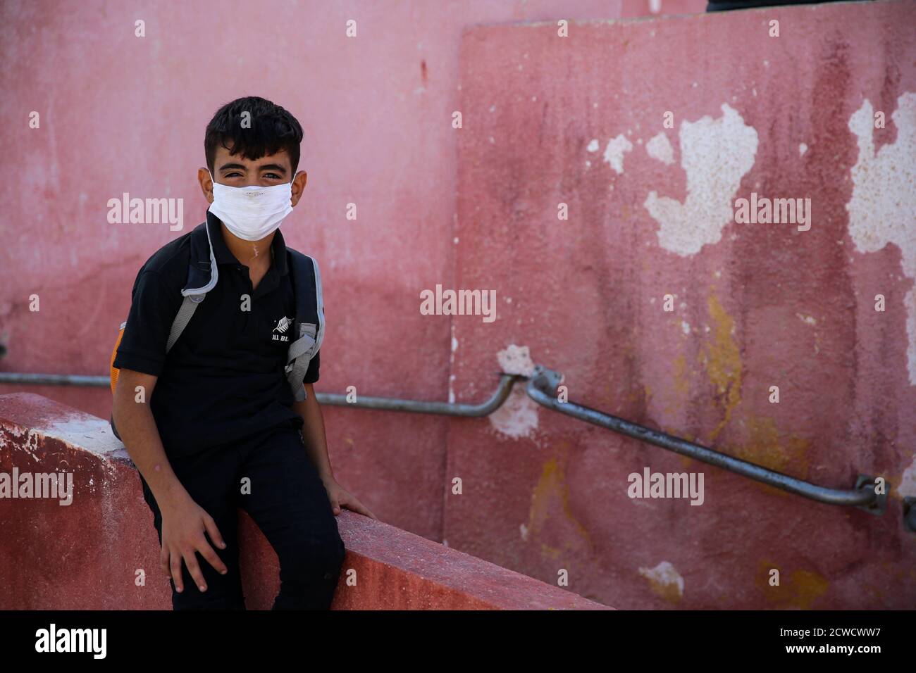 September 28, 2020: Idlib, Syria. 28 September 2020. Children return to school at the beginning of the new academic year observing some precautionary measures to avoid the spread of the Coronavirus. There has been a relatively low number of Covid-19 infections and deaths in the opposition- controlled areas in northwestern Syria, as they have remained isolated from surrounding territories. Yet, a major virus outbreak would constitute a catastrophe in the devastated region, with its high population density, the congestion in camps, the lack of basic infrastructures, and a shattered health care s Stock Photo