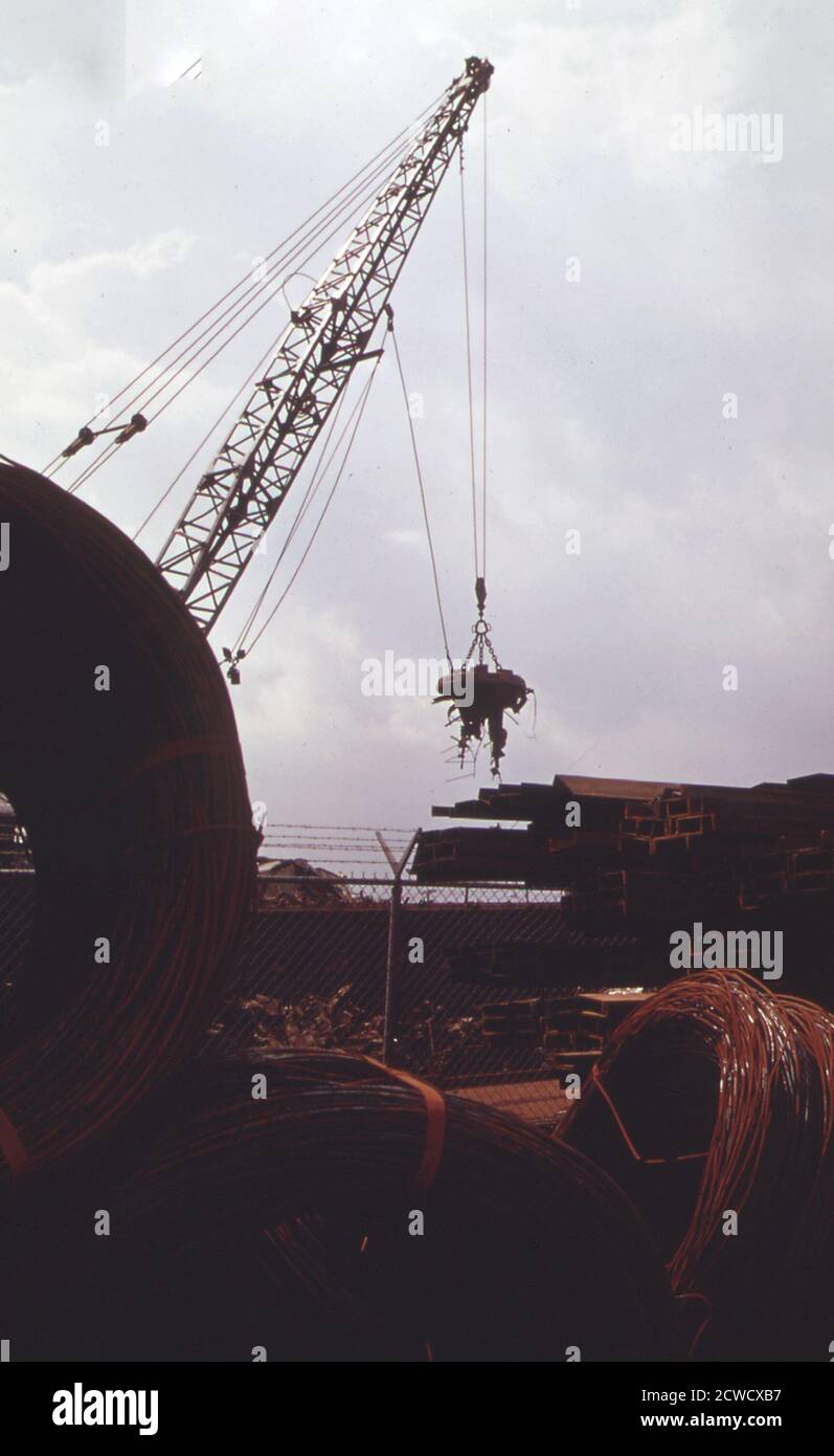 Scrap metal yard on waterfront Rhode Island ca. April 1973 Stock
