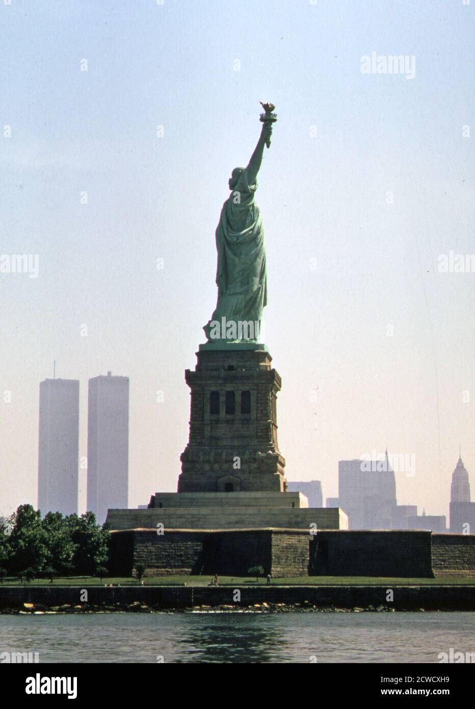 Statue of Liberty and the Manhattan New York skyline ca.  July 1974 Stock Photo