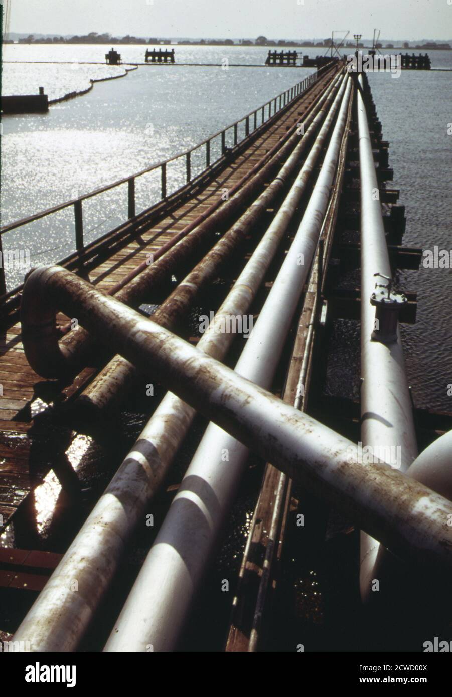 Pipelines from dock of Northeast Petroleum tanker terminal on Mt. Hope Bay. to guard against oil