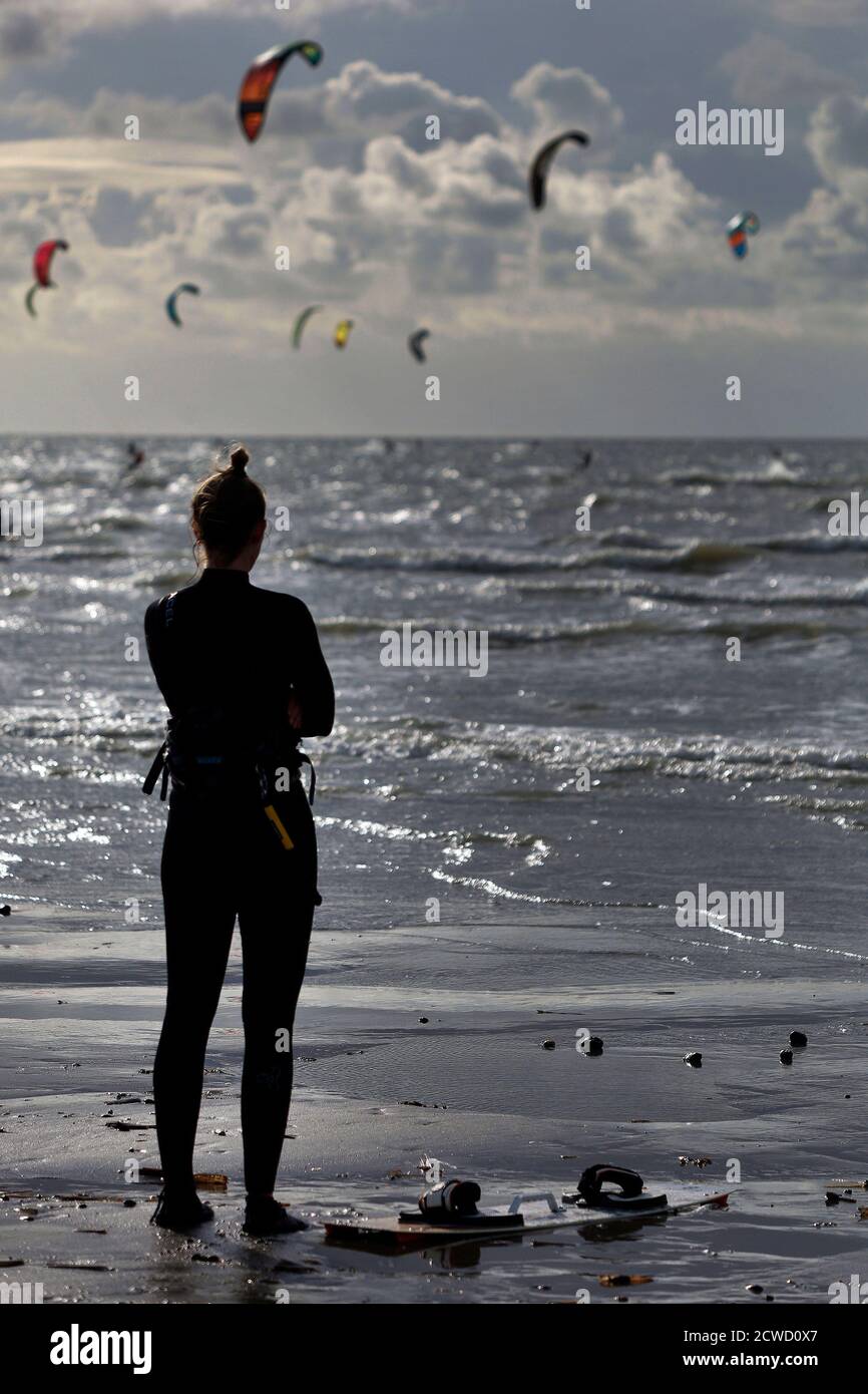 Netherlands, Kitesurfing,  26.09.2020 Kitesurfers  are surfing on the north sea near to the Brouwersdam  embankment in the Netherlands  Photo by Norbe Stock Photo